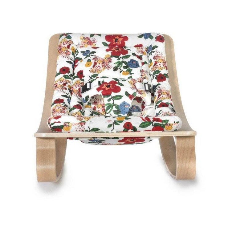 This adorable baby rocker from Charlie Crane will let you keep your little one close while still being comfortably settled. We love its original pattern!