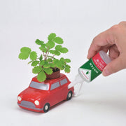 NOTED - Self watering plant - Red car - Scene